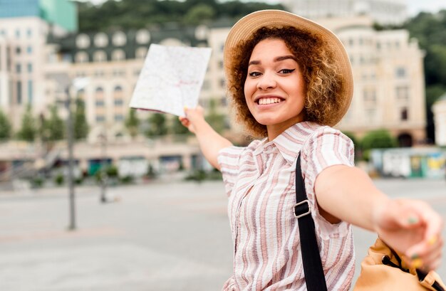 Woman traveling alone with a map