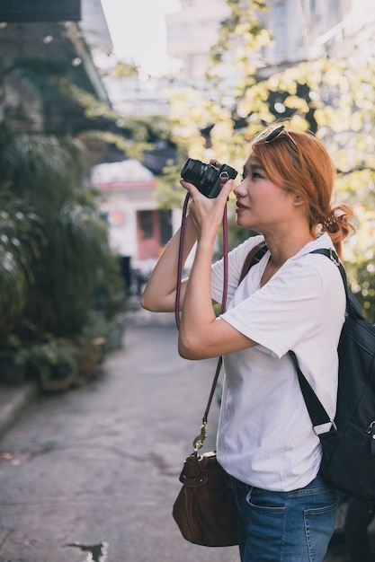 Woman traveling and taking pictures