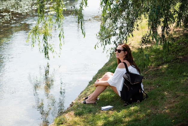 Free photo woman traveling in a white cute dress