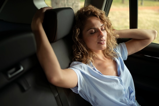 Free photo woman traveling with her car