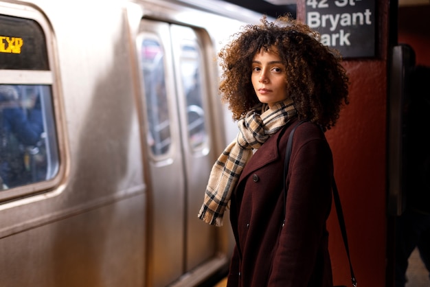 Free photo woman traveling with the subway in the city