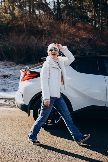 Woman travelling by car stopped by on the road