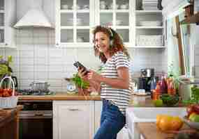 Free photo woman turning on her favorite song