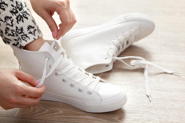 Woman tying shoelaces