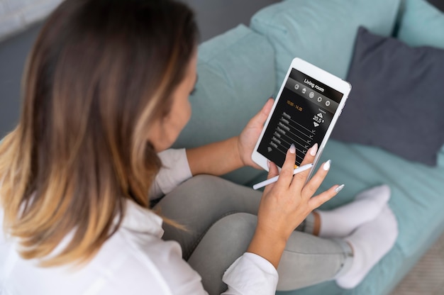 Woman using a digital assistant on her tablet