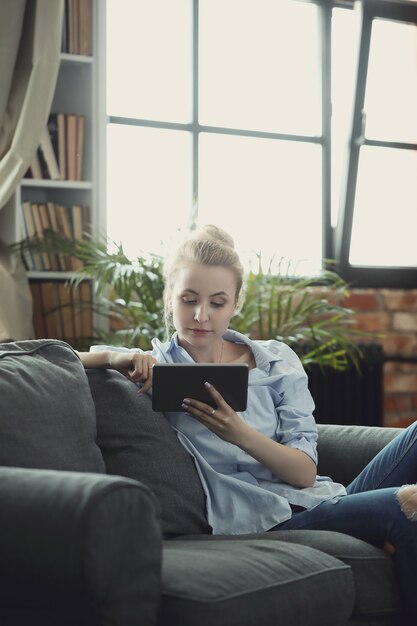 woman using digital tablet or smartphone