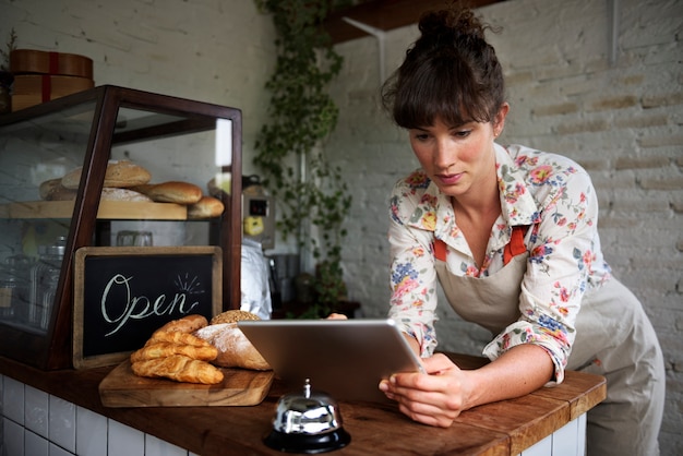 Free photo woman using digital tablet