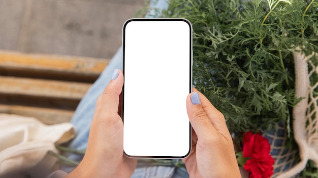 Woman using her smartphone outdoors