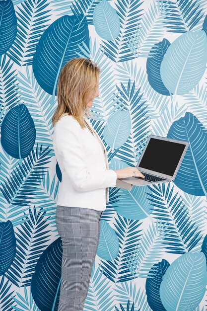 Woman using laptop in office