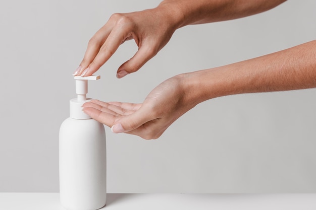 Woman using liquid soap copy space