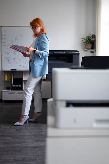 Woman using printer at the office