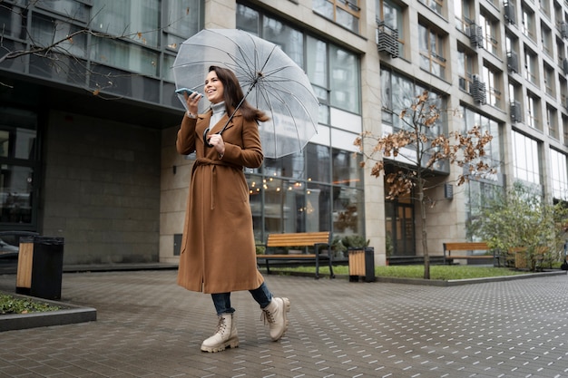 Free photo woman using smartphone as a habit