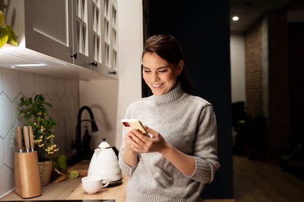 Free Photo woman using smartphone as a habit