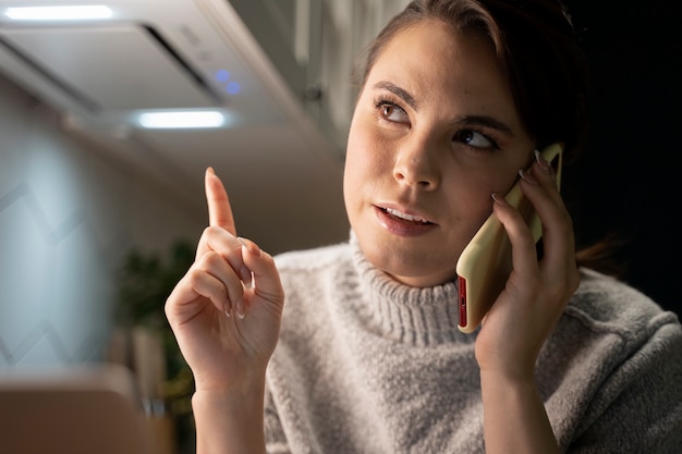 Free Photo woman using smartphone as a habit