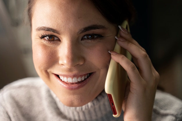 Free photo woman using smartphone as a habit