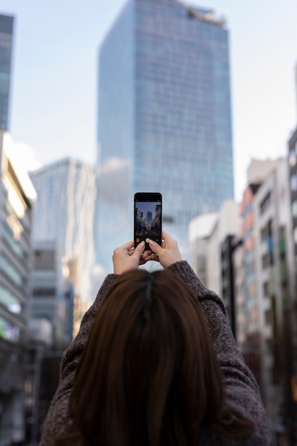 Free photo woman using smartphone technology