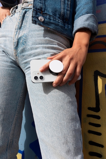 Woman using smartphone with pop socket