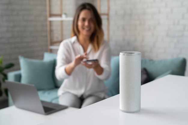 Woman using a speaker digital assistant