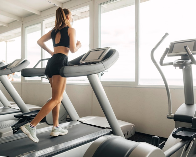 Woman using the treadmill at the gym