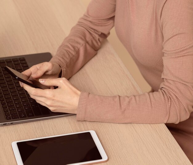 Woman using various digital devices