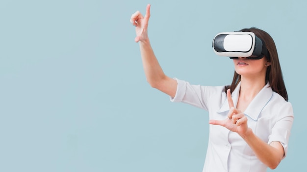 Woman using virtual reality headset with copy space