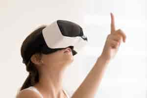 Free photo woman using vr glasses for interactive videos