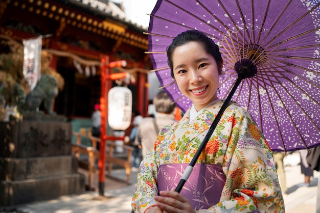 Woman using wagasa umbrella medium shot