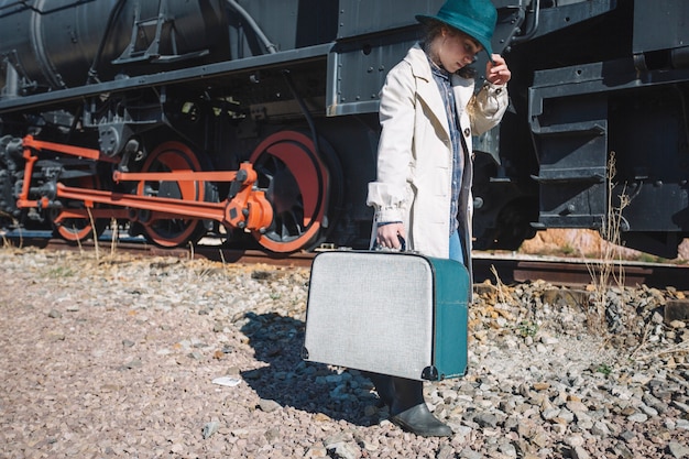 Free photo woman in vintage clothes at train