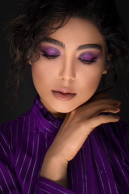 Woman in violet eye shadow