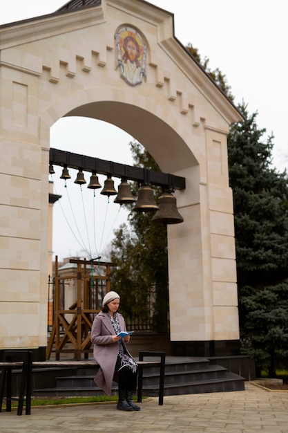 Woman visiting church for religious pilgrimage