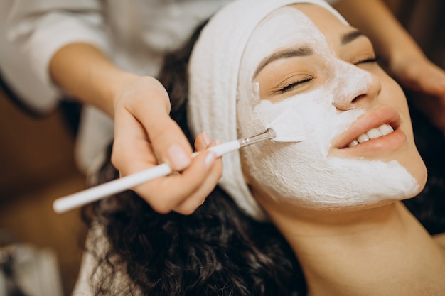 Woman visiting cosmetologist and making rejuvenation procedures