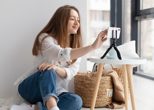 Woman vlogging with her phone