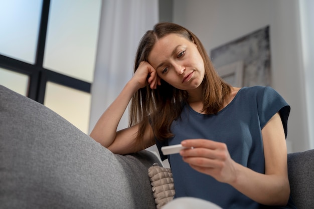 Free photo woman waiting for a covid test result