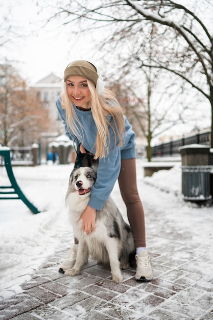 Woman walking accompanied by her pet