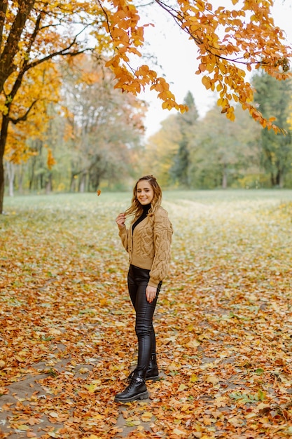 Woman walking in the autumn park