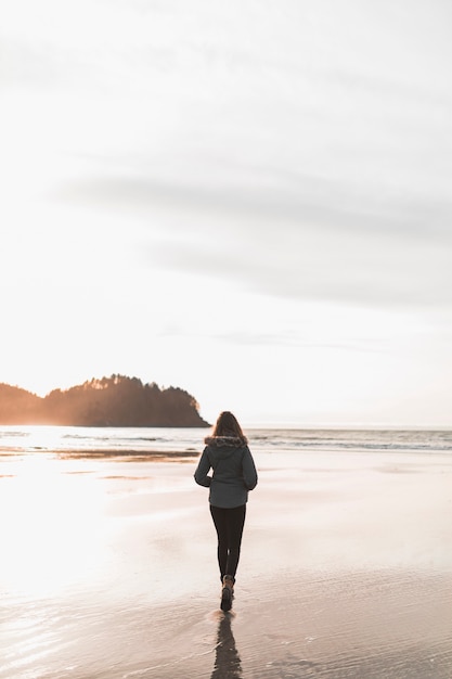 Free photo woman walking near sea