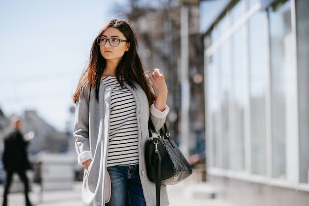 Woman walking near a showcase