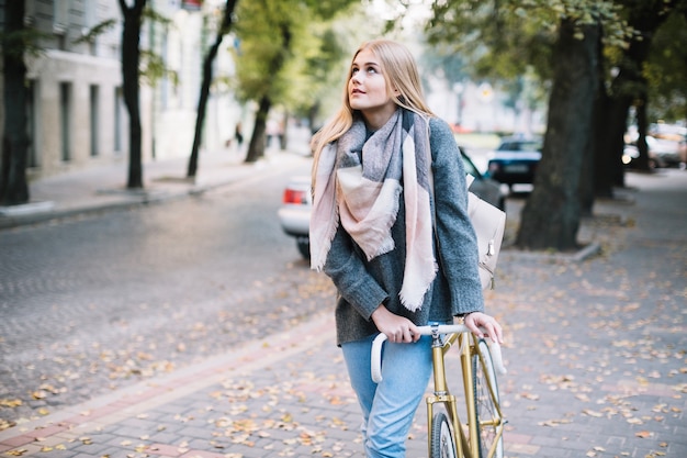 Woman walking with bicycle