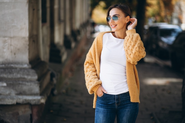 Free photo woman in warm cloths outside in autumn park