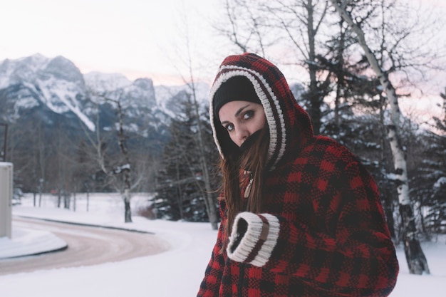 Woman in warm jacket on nature background