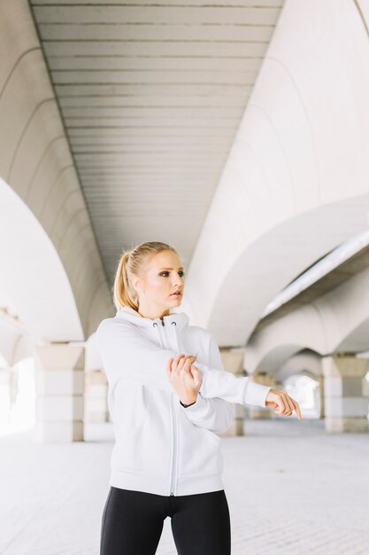 Woman warming up on street