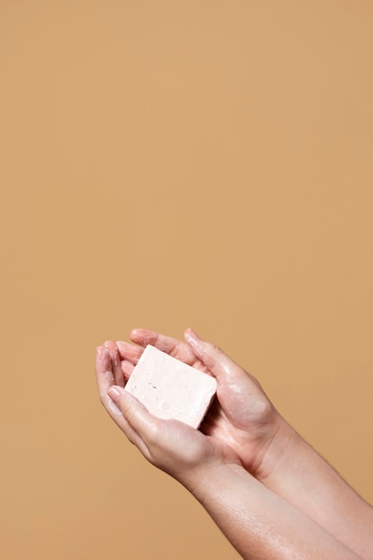 Woman washing hands with soap