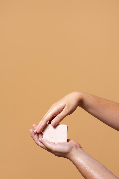 Free Photo woman washing hands with soap