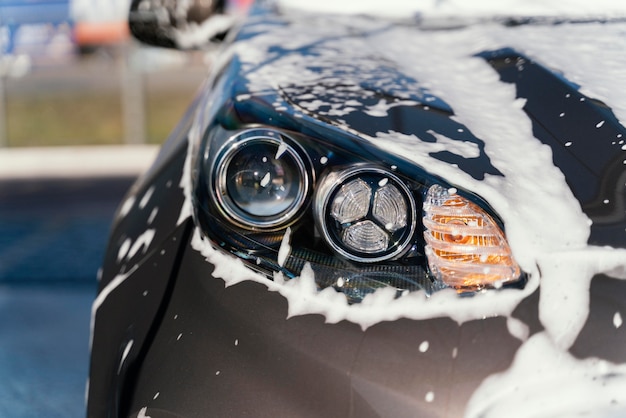 Woman washing her car outdoors