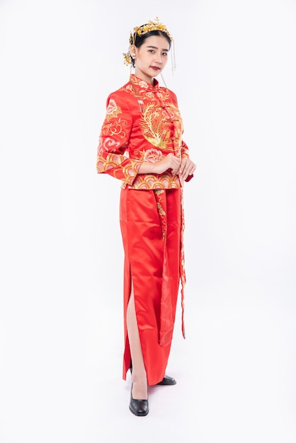 Free Photo woman wear cheongsam suit promote to welcome traveller shopping in chinese new year