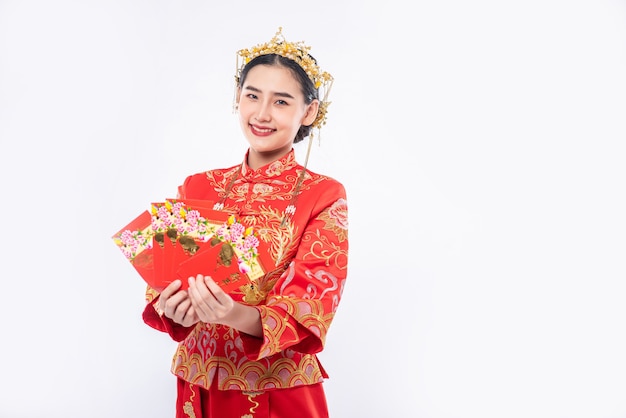 Free Photo woman wear cheongsam suit smile to get gift money from boss in chinese new year