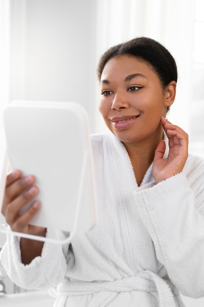 Woman wearing bathrobe front view