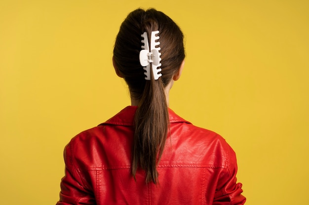 Free Photo woman  wearing big hair clip back view