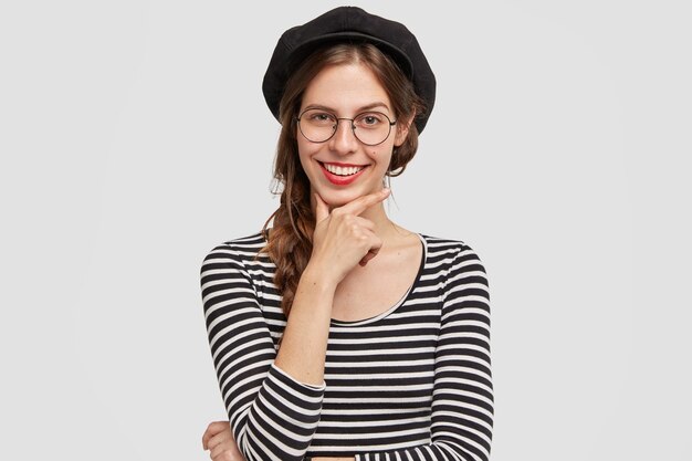 Woman wearing black stylish beret and striped blouse