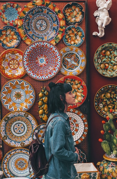 Free photo woman wearing blue denim jacket across plates